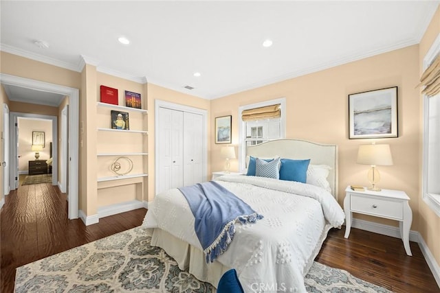 bedroom with visible vents, wood finished floors, a closet, and ornamental molding