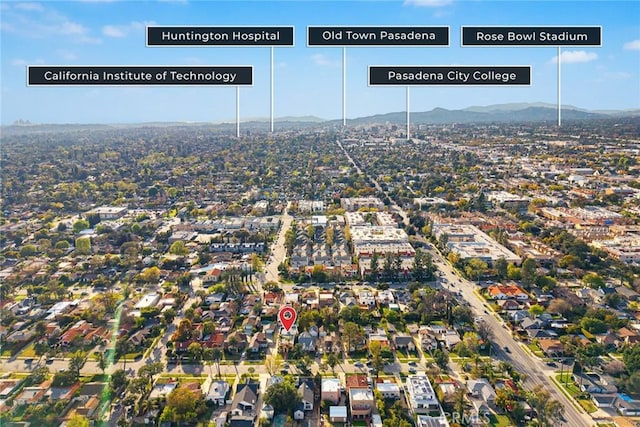 birds eye view of property with a mountain view and a residential view