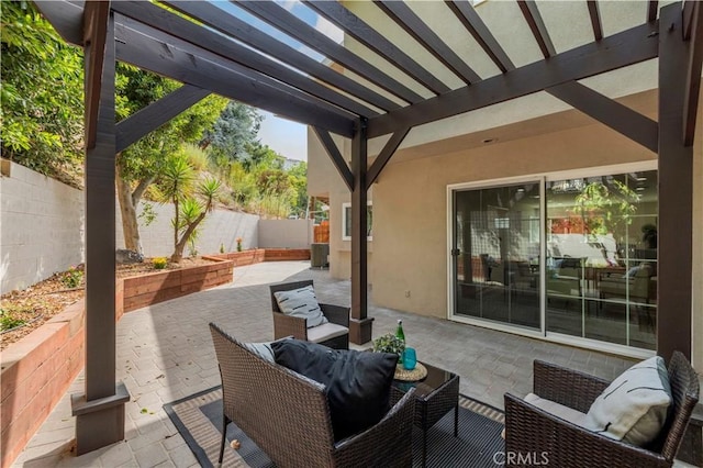 view of patio with an outdoor living space, a fenced backyard, and a pergola