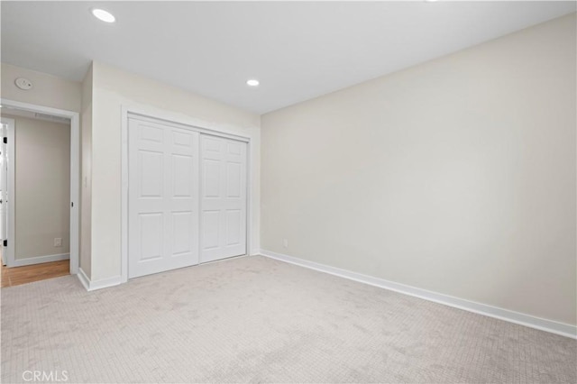 unfurnished bedroom featuring recessed lighting, baseboards, and carpet floors