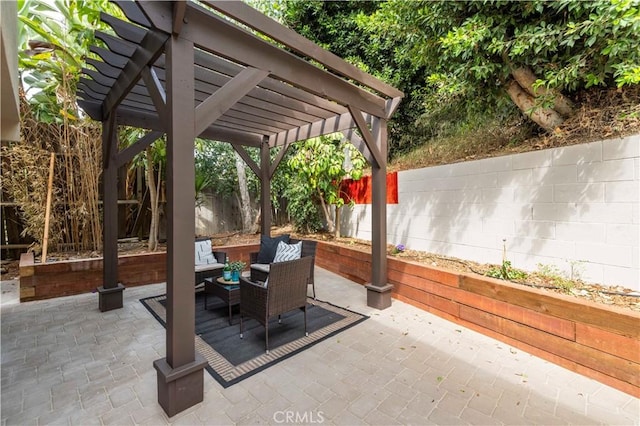 view of patio with a fenced backyard, a pergola, and an outdoor hangout area