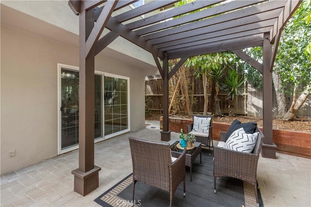 view of patio / terrace with outdoor lounge area, fence, and a pergola