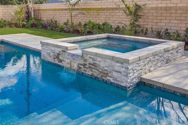 outdoor pool featuring a fenced backyard