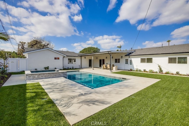 back of property featuring stucco siding, a lawn, a gate, a fenced in pool, and a patio area