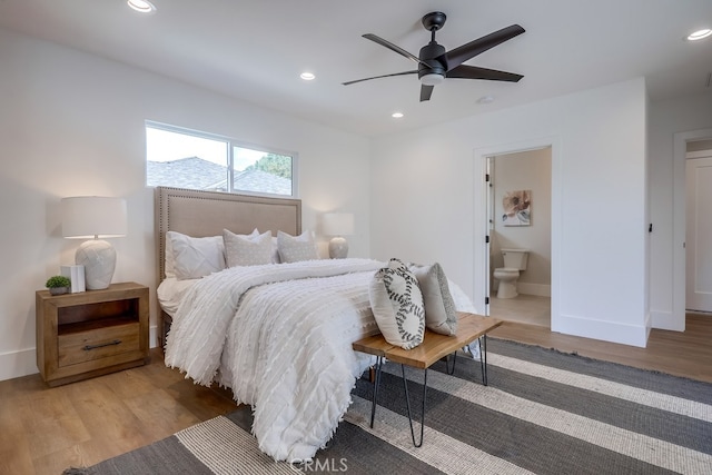 bedroom with recessed lighting, baseboards, and wood finished floors