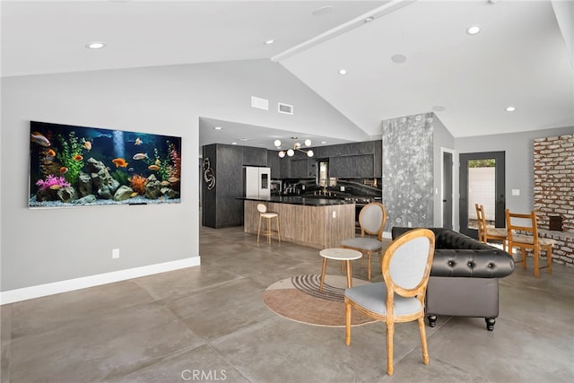 living area with high vaulted ceiling, visible vents, baseboards, and finished concrete floors