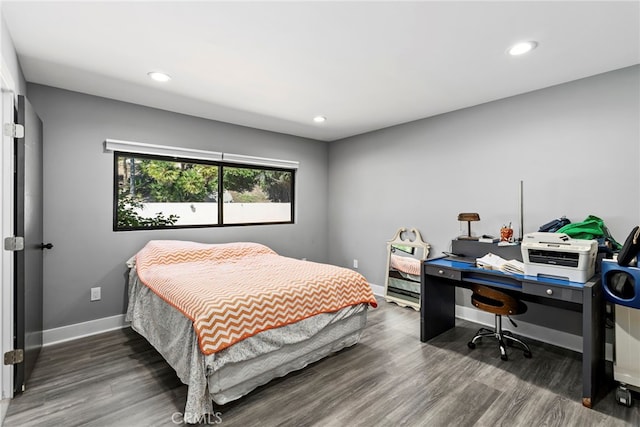 bedroom featuring recessed lighting, wood finished floors, and baseboards