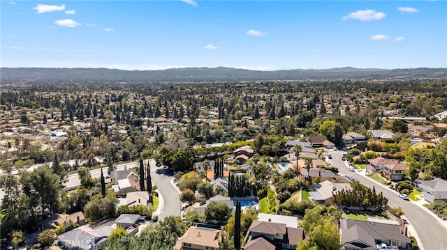 birds eye view of property with a mountain view and a residential view