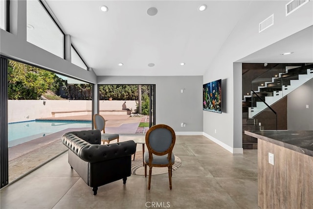 interior space with visible vents, recessed lighting, high vaulted ceiling, and finished concrete floors