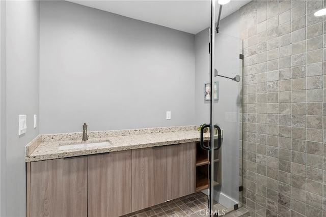 bathroom featuring vanity and a shower stall