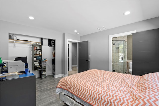 bedroom featuring recessed lighting, a closet, baseboards, and wood finished floors