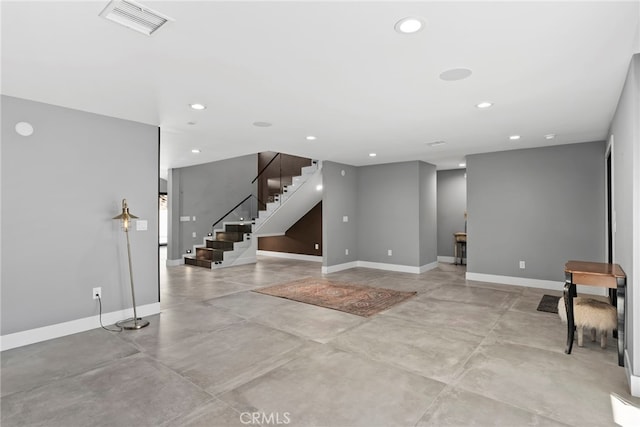 foyer entrance featuring visible vents, recessed lighting, baseboards, concrete flooring, and stairs