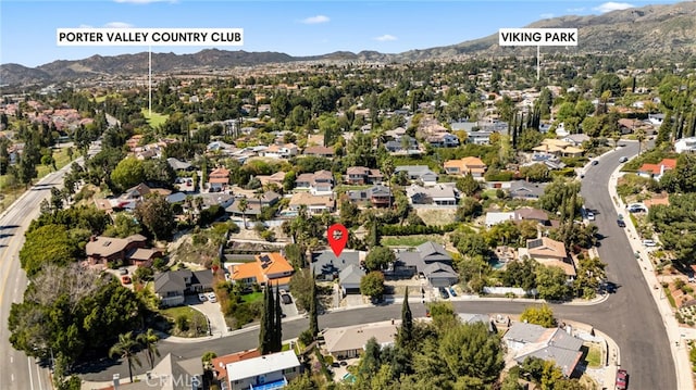 drone / aerial view with a residential view and a mountain view