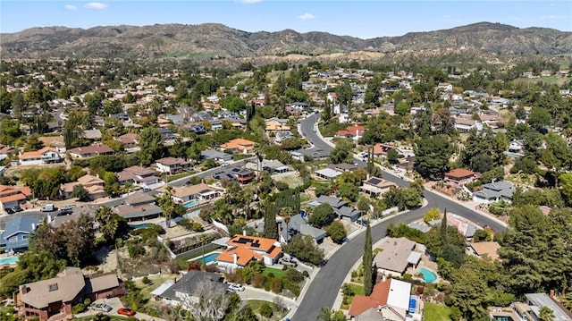 drone / aerial view featuring a residential view and a mountain view