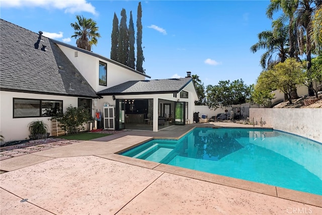 view of pool with a fenced in pool, a patio area, and fence