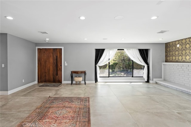 foyer featuring recessed lighting and visible vents