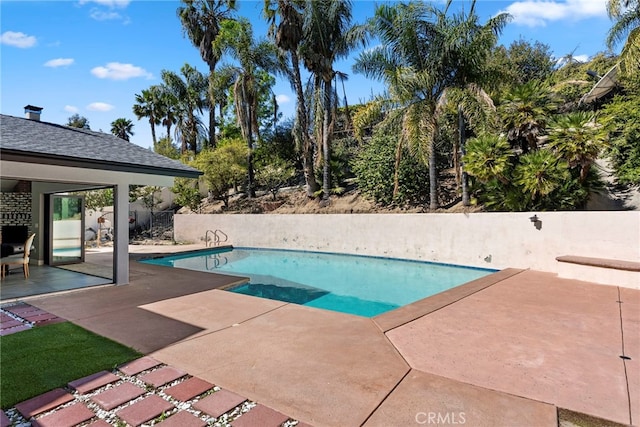 view of swimming pool featuring a patio area and a fenced in pool