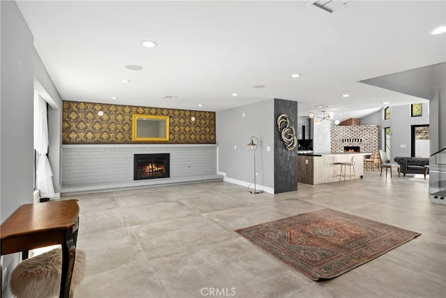 living area featuring visible vents, recessed lighting, a fireplace, and baseboards