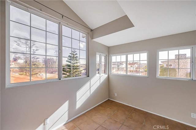 unfurnished sunroom with lofted ceiling