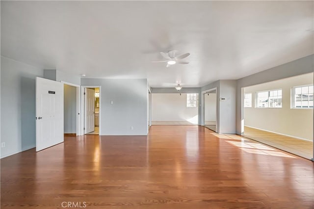 spare room featuring ceiling fan and wood finished floors