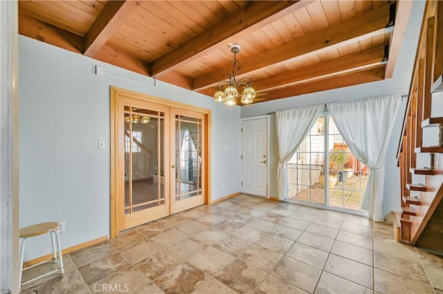 interior space featuring beam ceiling, stairway, an inviting chandelier, and baseboards