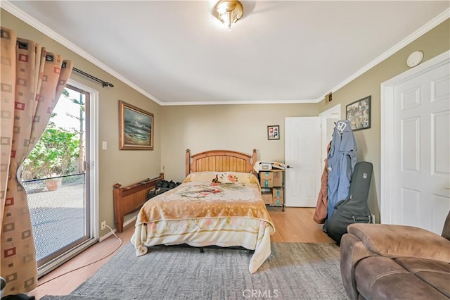 bedroom with visible vents, light wood-style flooring, crown molding, and access to outside