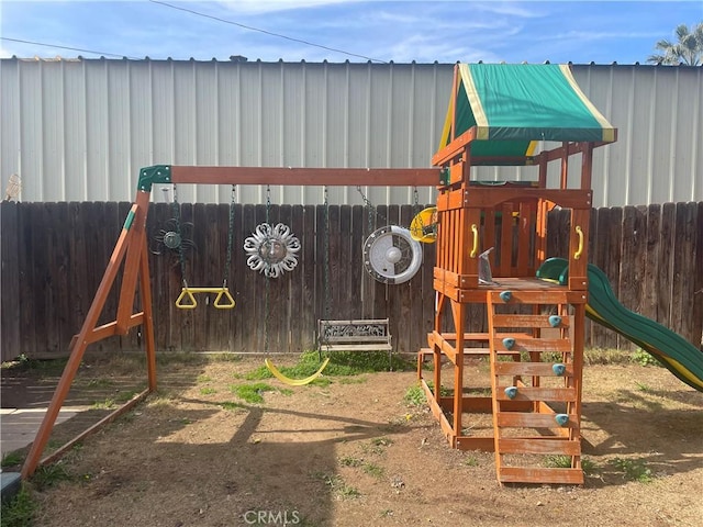 view of playground featuring fence