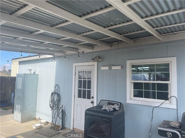 view of patio with fence and washer / clothes dryer