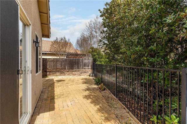 exterior space with a fenced backyard and a patio