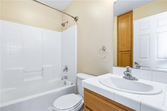 full bath with vanity, shower / tub combination, and toilet