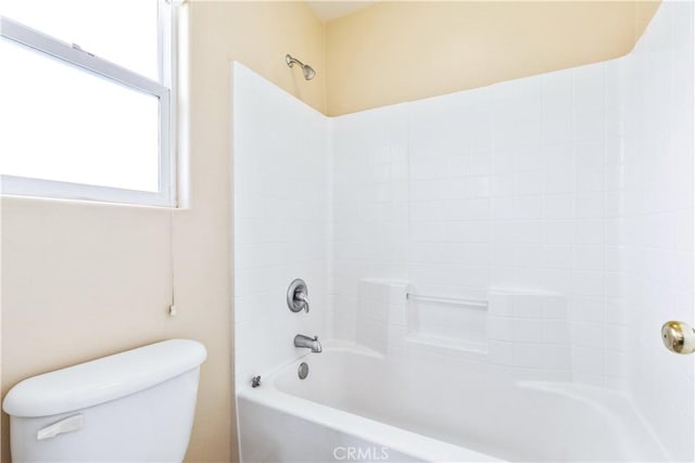 bathroom featuring toilet and bathtub / shower combination