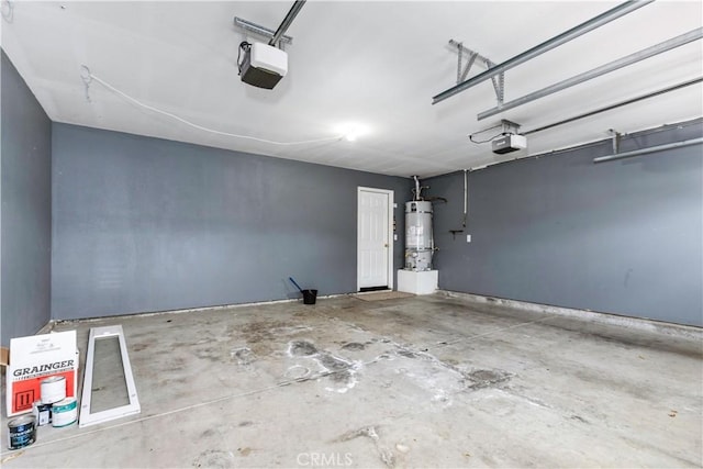 garage featuring strapped water heater and a garage door opener