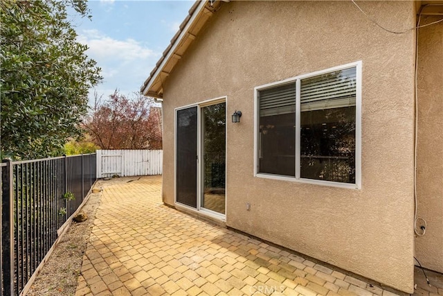 view of patio / terrace featuring fence