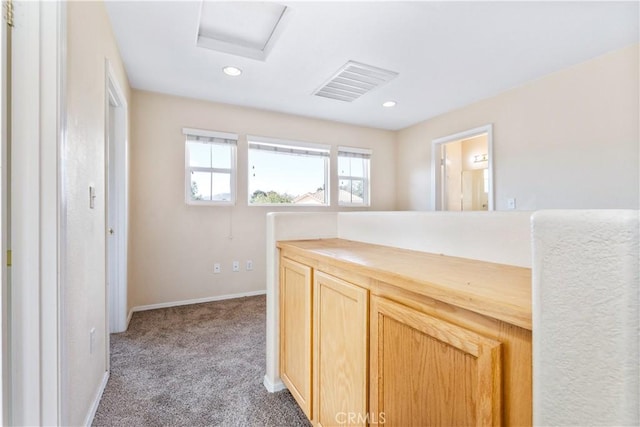 corridor featuring visible vents, recessed lighting, carpet floors, baseboards, and attic access