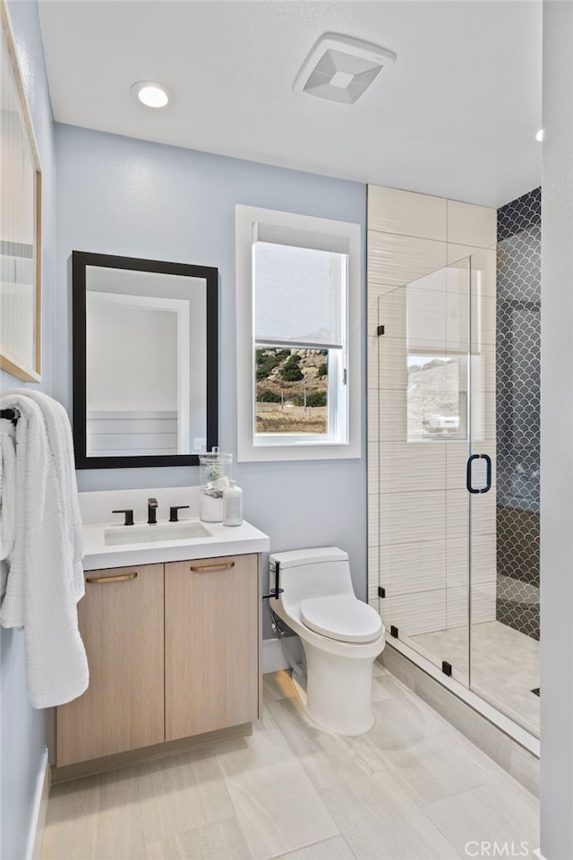9522 N Andora Ave, Chatsworth, CA 91311 - full bath with visible vents, baseboards, toilet, vanity, and a stall shower