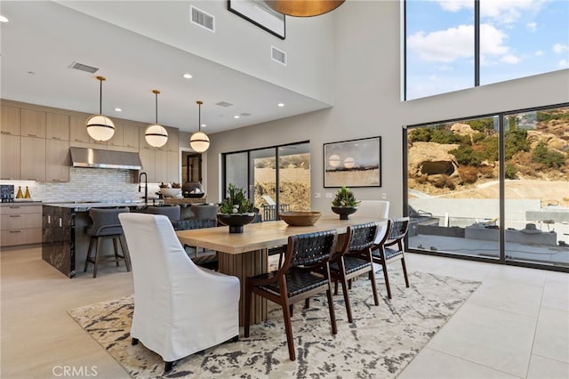 9522 N Andora Ave, Chatsworth, CA 91311 - dining area featuring light tile patterned flooring, a towering ceiling, and visible vents