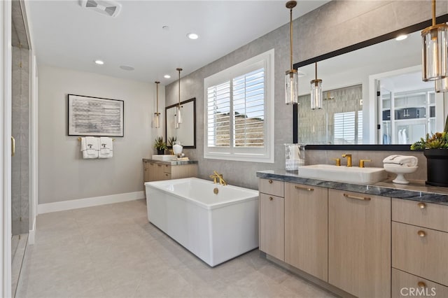 9522 N Andora Ave, Chatsworth, CA 91311 - full bathroom featuring visible vents, baseboards, a freestanding bath, a sink, and two vanities