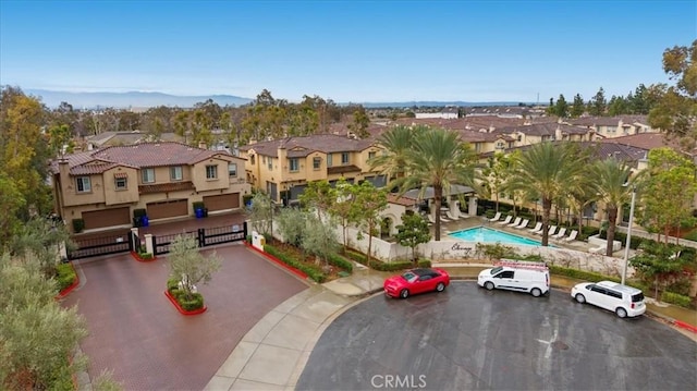 birds eye view of property with a residential view