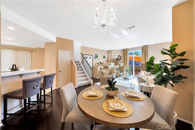 dining space featuring stairs, dark wood-style floors, a chandelier, baseboards, and recessed lighting