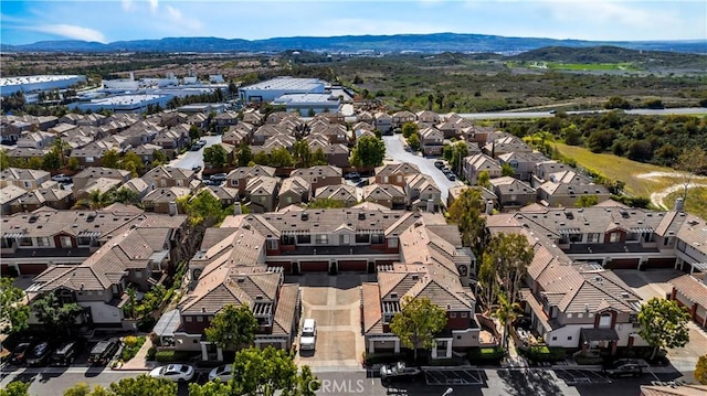aerial view of residential area featuring a mountain backdrop