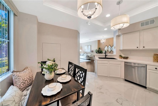 dining area featuring a tray ceiling, plenty of natural light, recessed lighting, light marble finish floors, and a chandelier