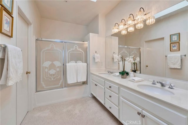 bathroom featuring enclosed tub / shower combo, a chandelier, double vanity, and a sink