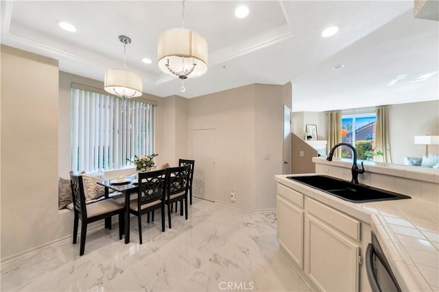 dining area featuring a raised ceiling, recessed lighting, baseboards, and light marble finish floors