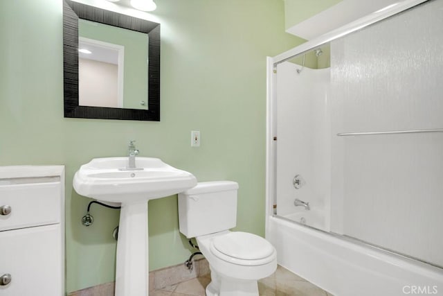 full bath with tile patterned floors, toilet, and shower / washtub combination