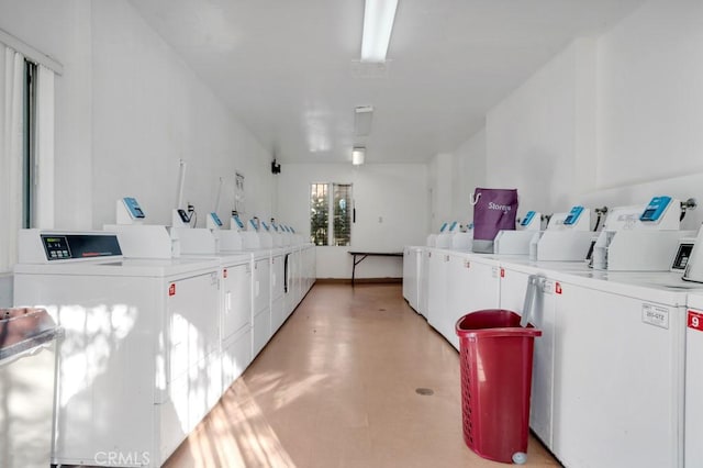 common laundry area with washing machine and clothes dryer