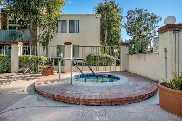 view of swimming pool featuring fence