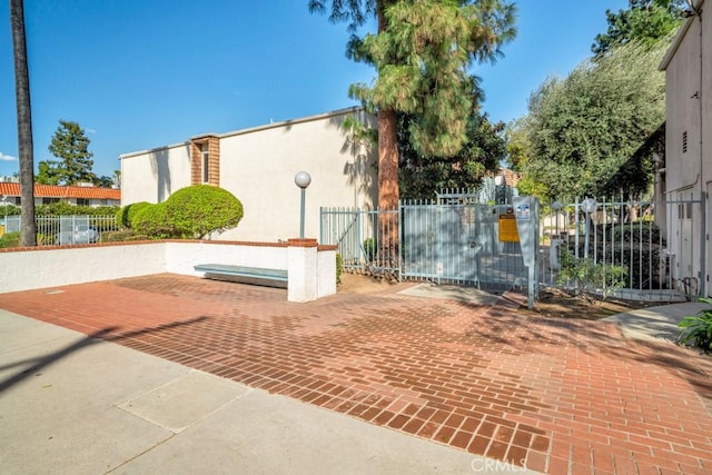 view of gate with fence