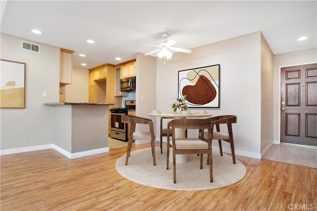 dining space with visible vents, recessed lighting, baseboards, and light wood-style floors