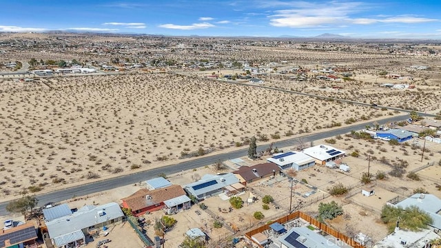 bird's eye view with view of desert and a mountain view