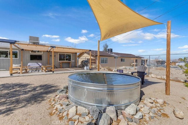 exterior space featuring a swimming pool, central AC unit, and fence